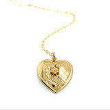 Gold heart-shaped pendant necklace on a white background