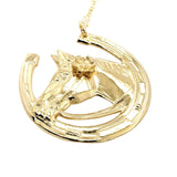 Gold pendant with a horse and horseshoe design on a white background
